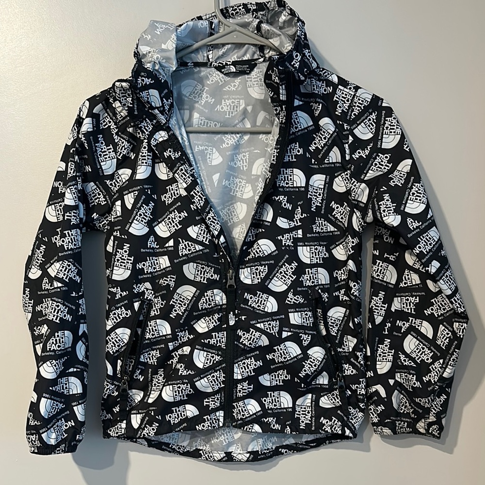 The North Face Black and White Raincoat with the North Face Pattern size S(7/8)